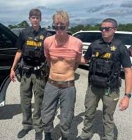 The Latest: Suspect in apparent assassination attempt against Trump charged with federal gun crimes