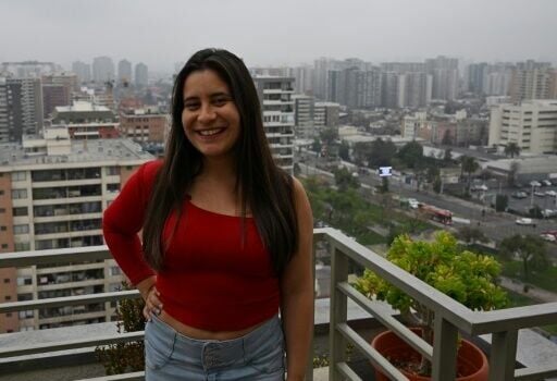 Lawyer Camila Ramirez, 29 -- shown here during an interview with AFP at her home in Santiago on August 29, 2024 -- says she does not want to give up her freedom to become a mother